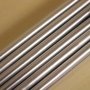 Several metal rods stacked closely together, showing a smooth surface and metallic finish.